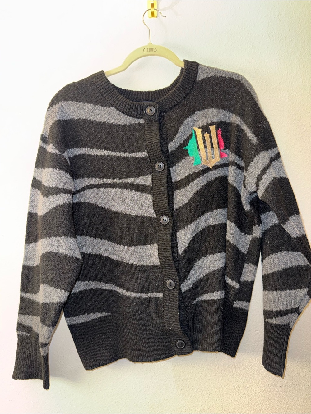 Wicked knit cardigan with embroidered graphic, Paul Tazewell comlection